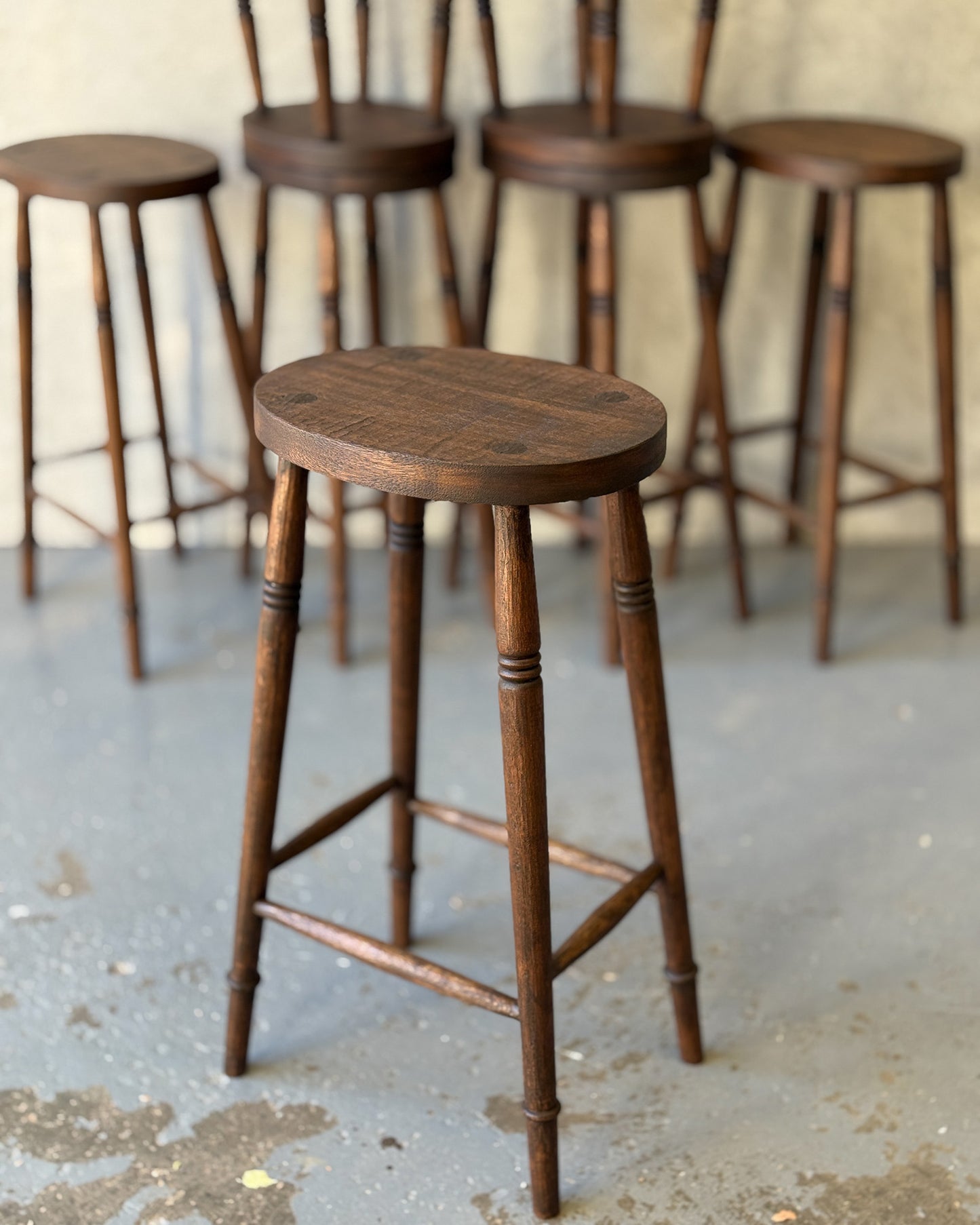 Three Alo Oval bar stools styled at a white kitchen island, handmade timber with turned legs, Sydney