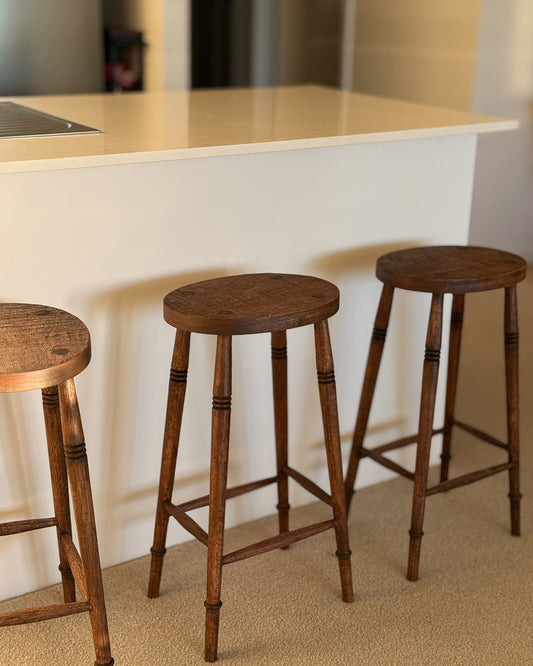  Alo Oval kitchen bar stools styled at a white kitchen island bench, handmade timber with turned legs, Sydney