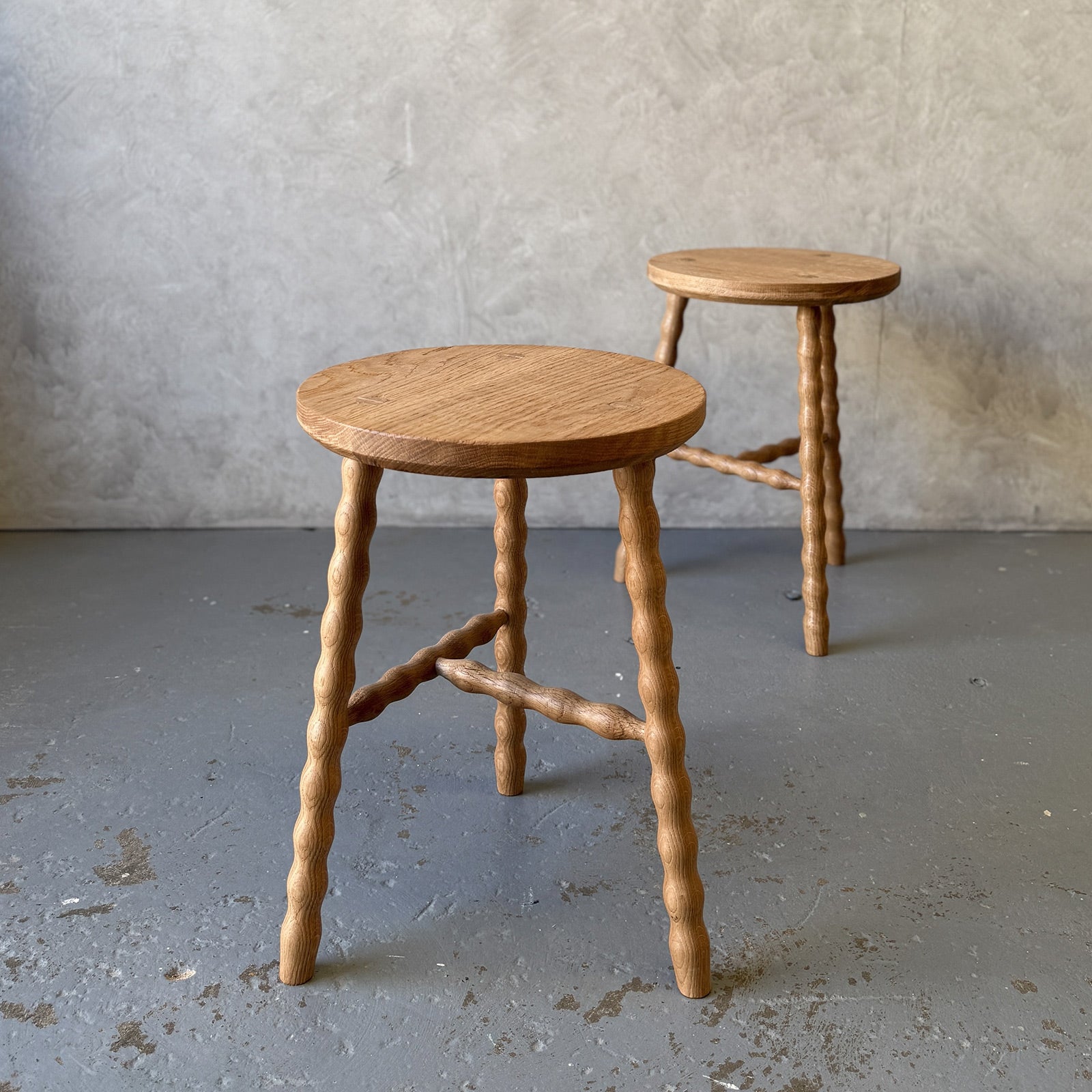 Round Bobbin Stool in American Oak with hand-turned legs, with stretcher base