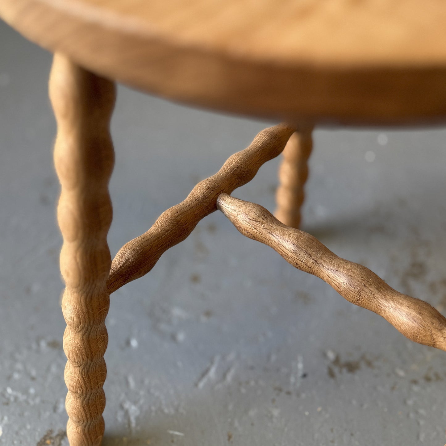 Round Bobbin Stool in American Oak with hand-turned legs, with stretcher base